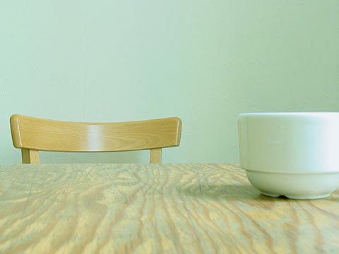 A cup, a chair and the table